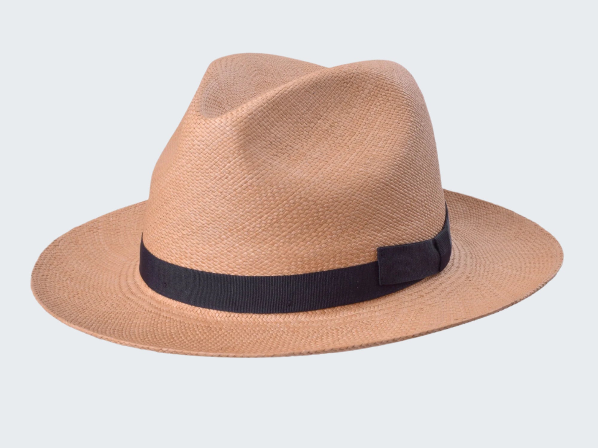 Beige straw hat with a black band on a white background
