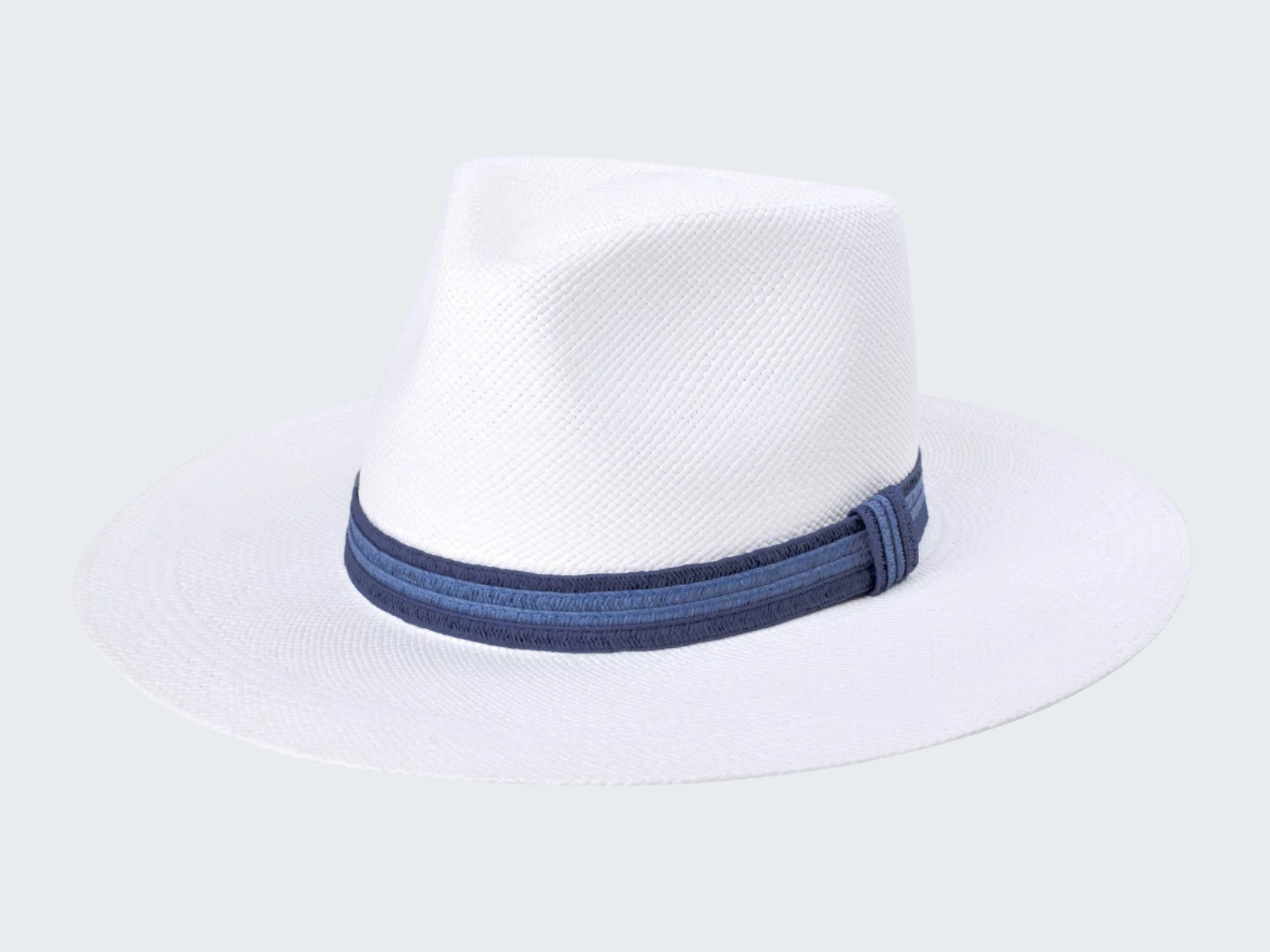 White straw hat with a blue band on a white background