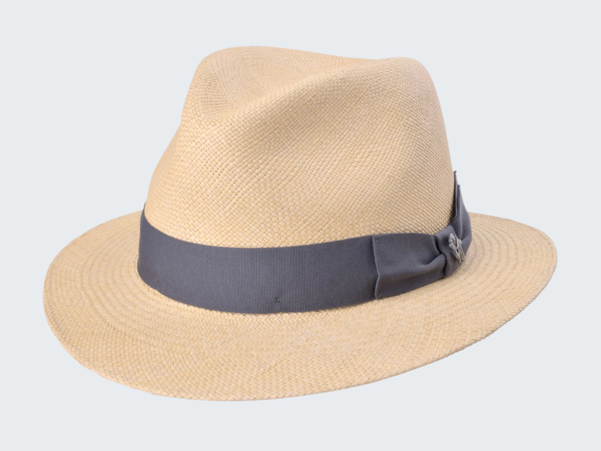 Beige straw hat with a dark band on a white background