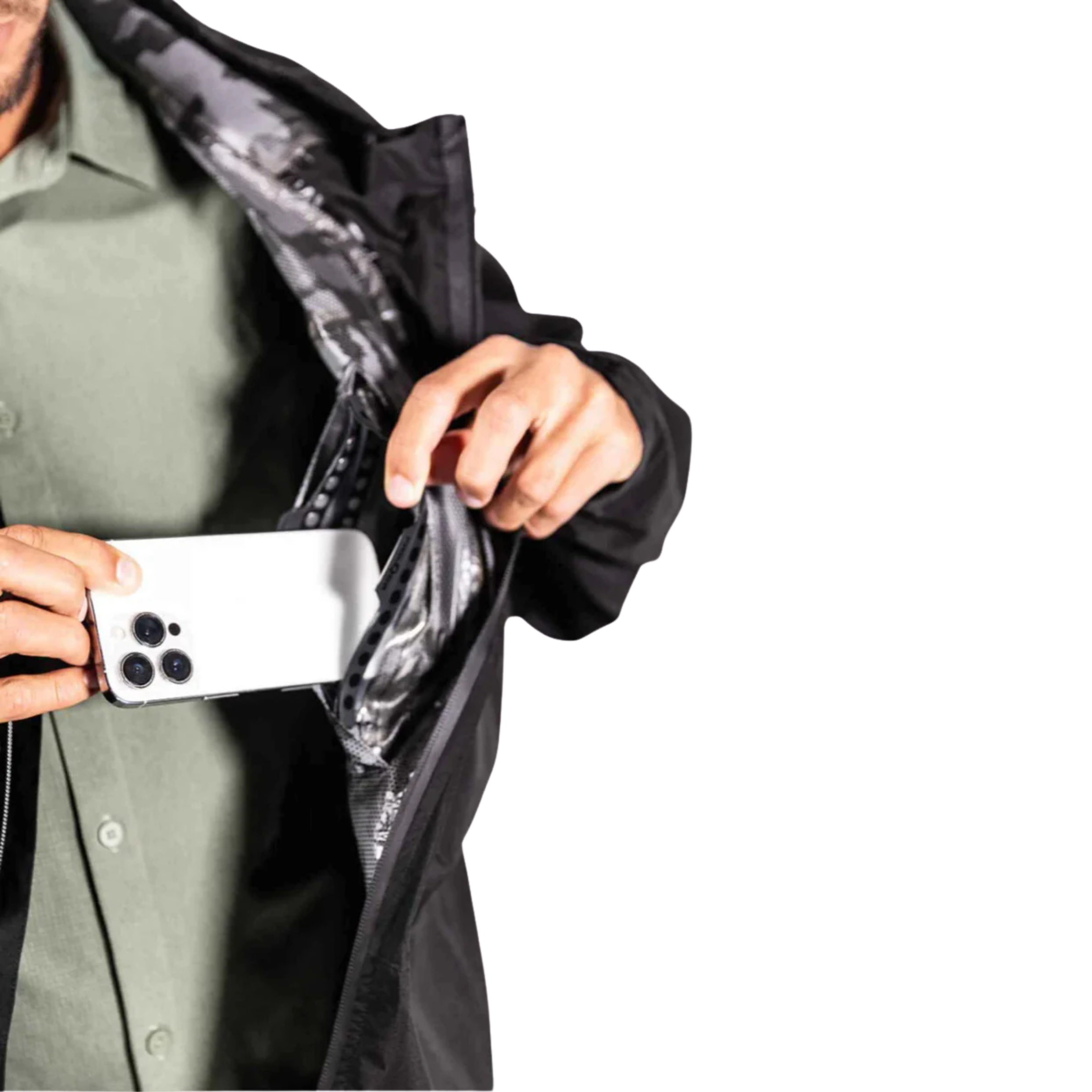 Person holding a phone with a black jacket open, showing a reflective lining.