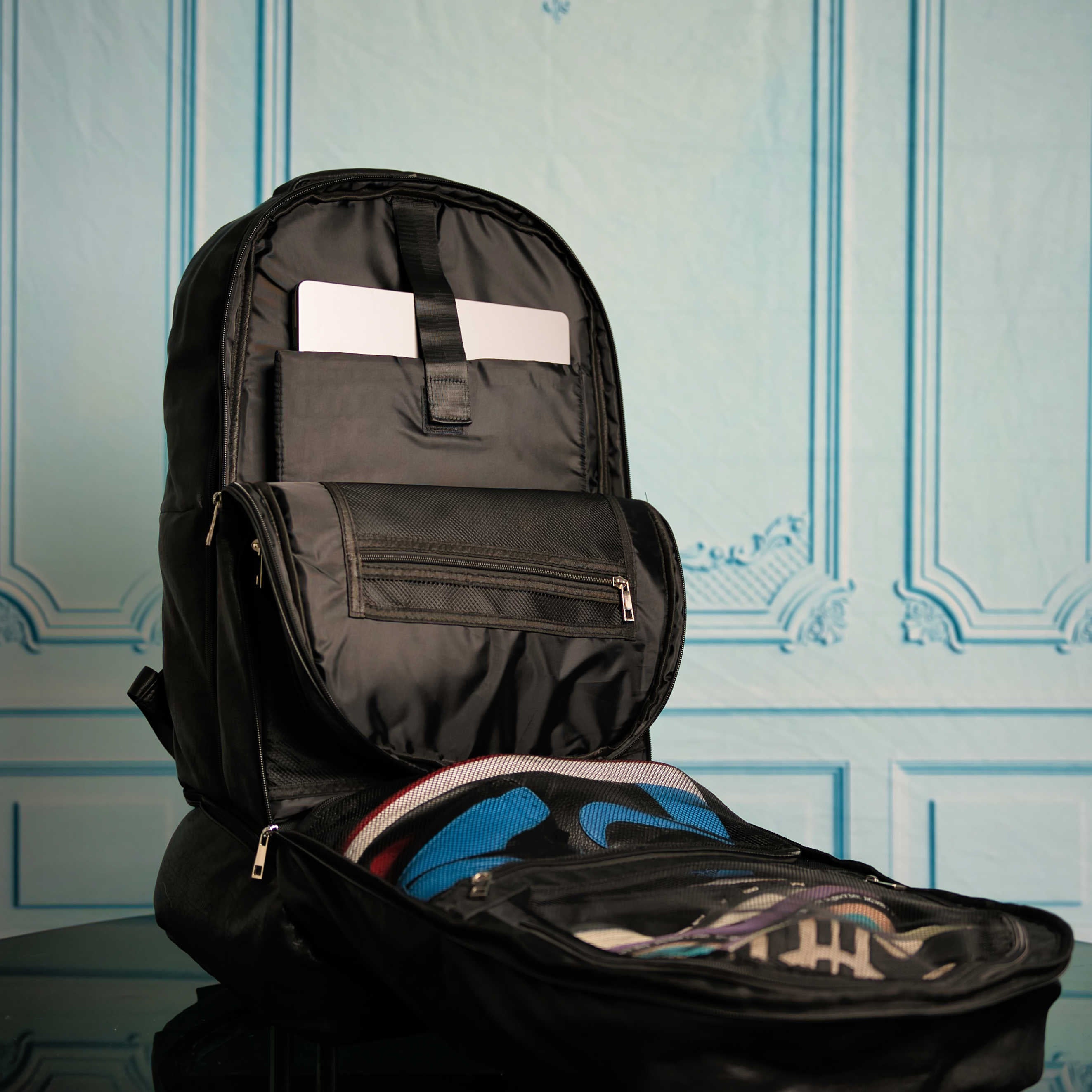 Black backpack with a shoe inside on a light blue patterned background