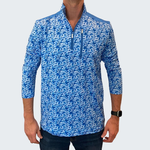Blue patterned pullover worn by a person on a white background