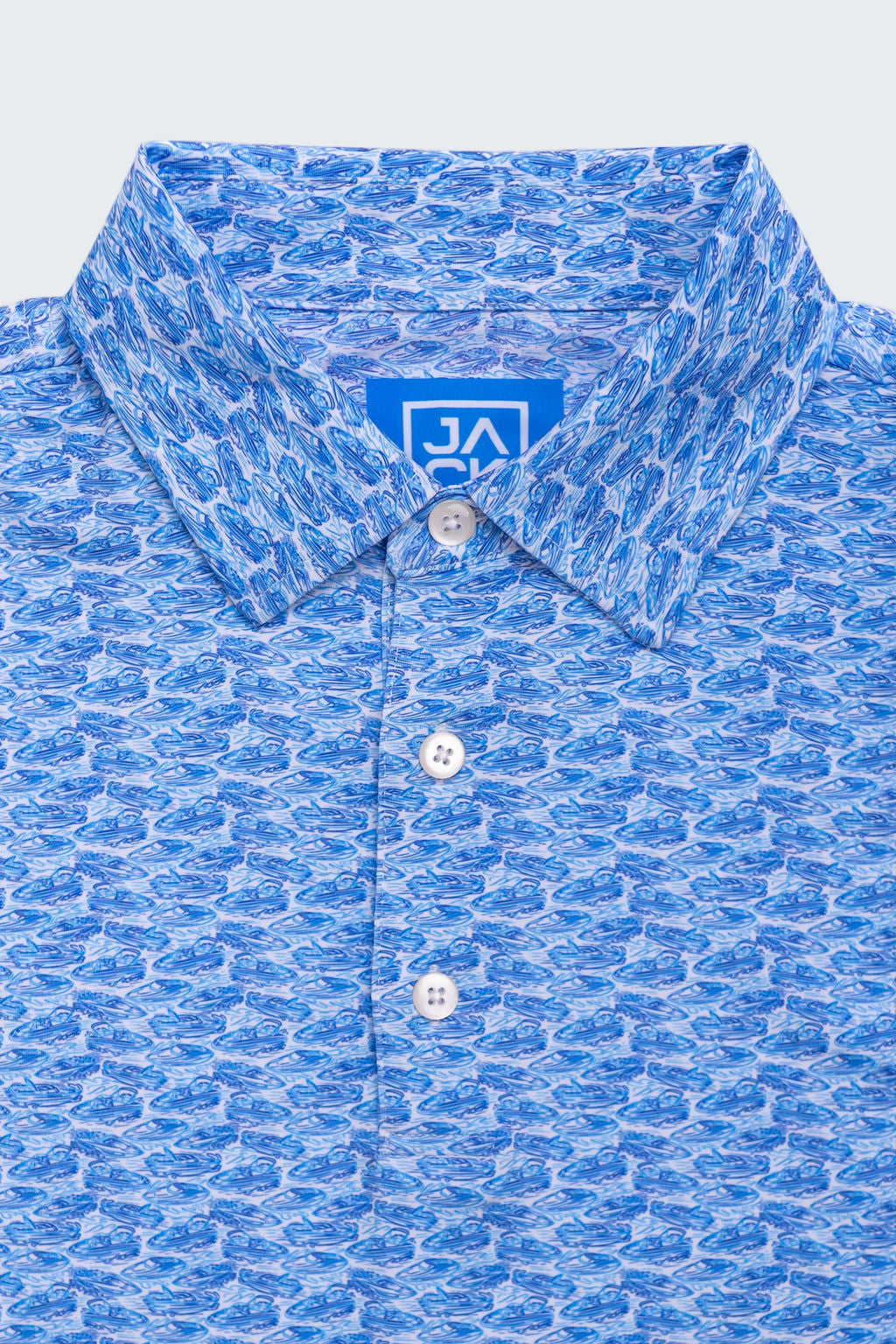 Blue patterned shirt with a brand logo on a white background