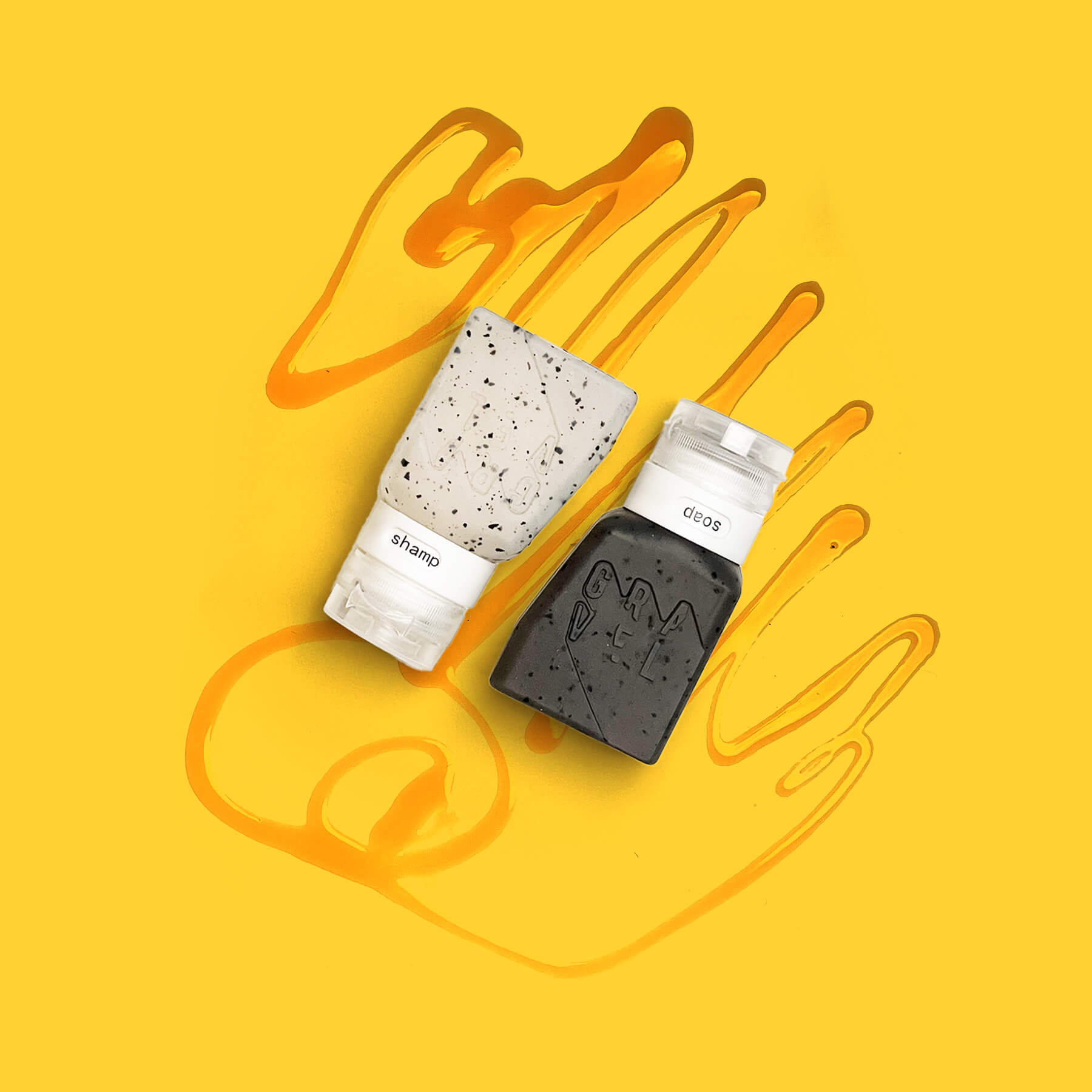 Two bottles of shampoo and conditioner on a yellow background with abstract designs.