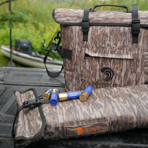 Camouflage hunting bag withammunition on a truck bed outdoors