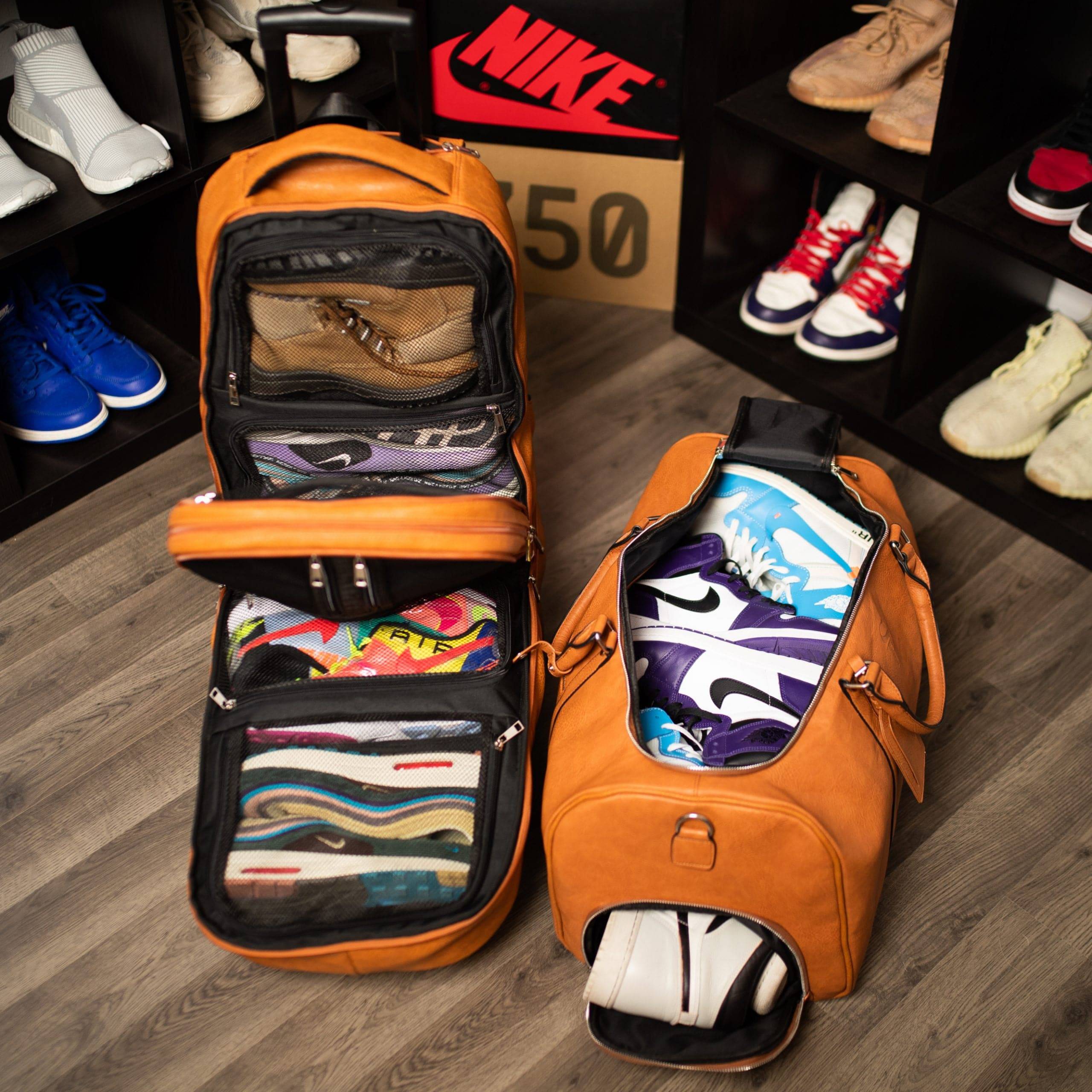 Orange shoe bag with colorful shoes on a wooden floor, with shelves of shoes in the background.