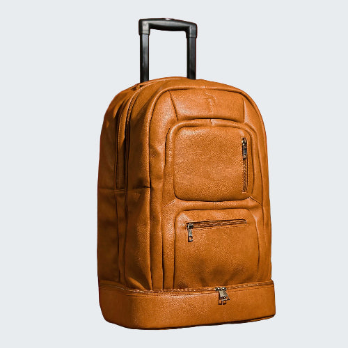 Brown leather suitcase with wheels on a red background