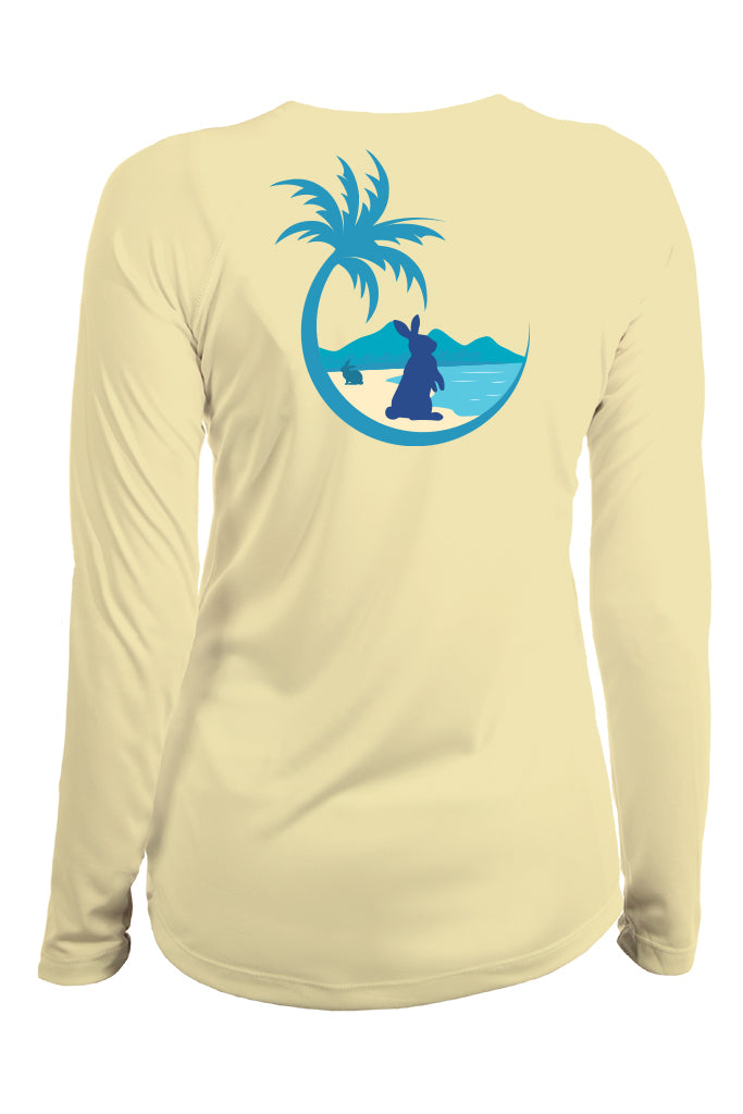 Beige long-sleeve shirt with a blue graphic of a palm tree, beach, and person on a white background