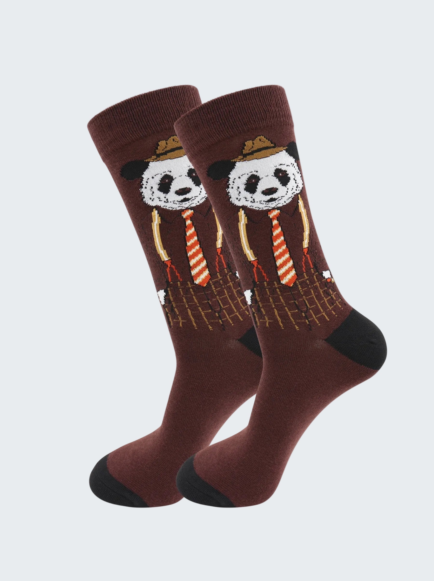 Pair of socks with panda design wearing hats and ties on a white background