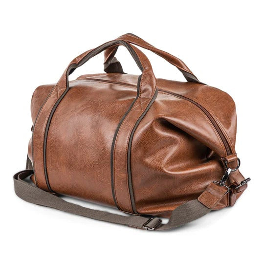 Brown leather duffel bag with a strap on a white background