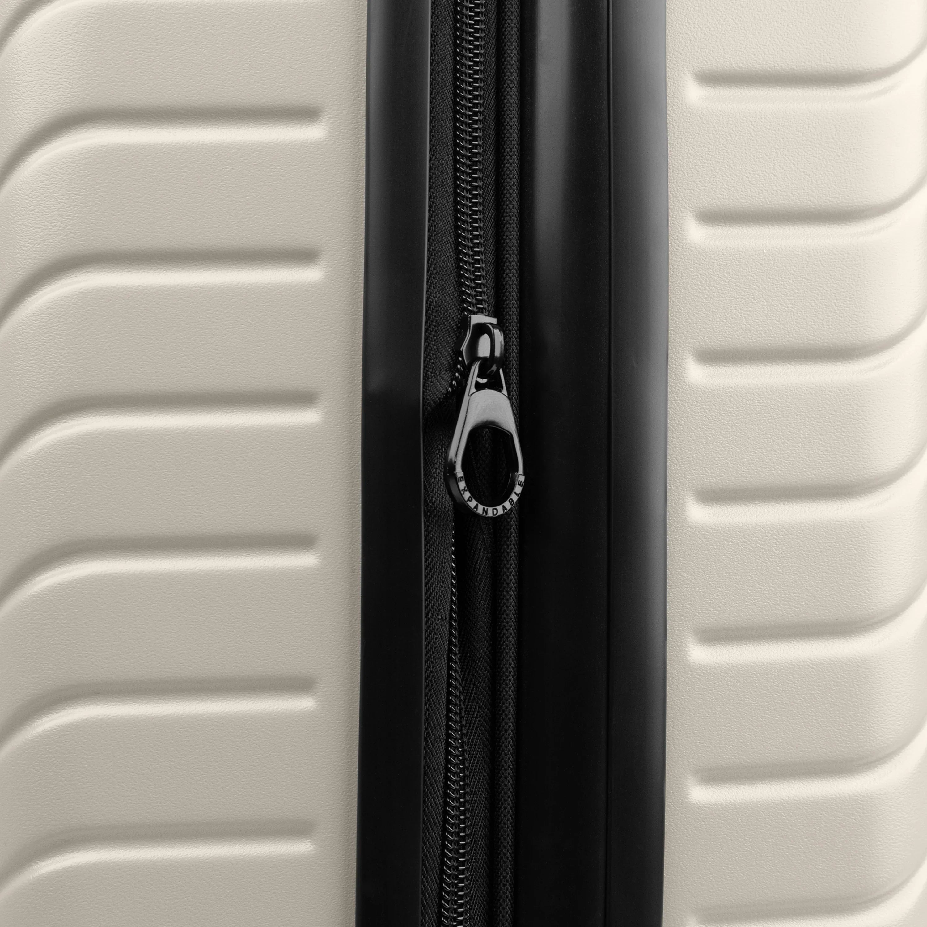 Close-up of a suitcase with a zipper on a light gray background