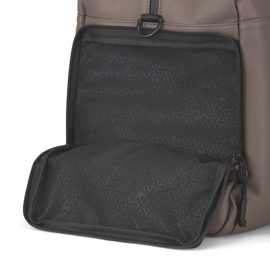 Brown backpack with open black compartment on a white background