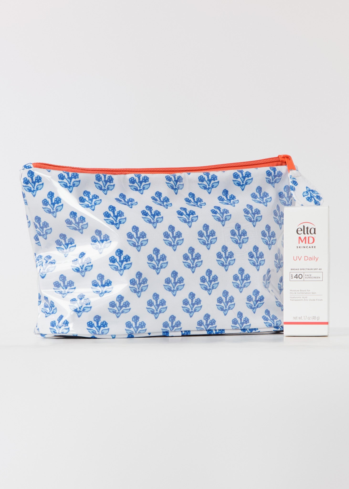 Pouch with blue floral pattern and orange zipper on a white background