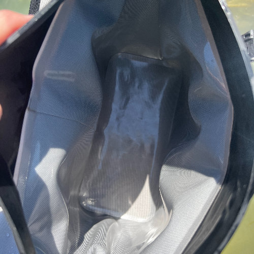 Close-up of a black diving mask with a blurred background