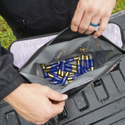Person opening a black case filled with blue and gold shotgun shells.