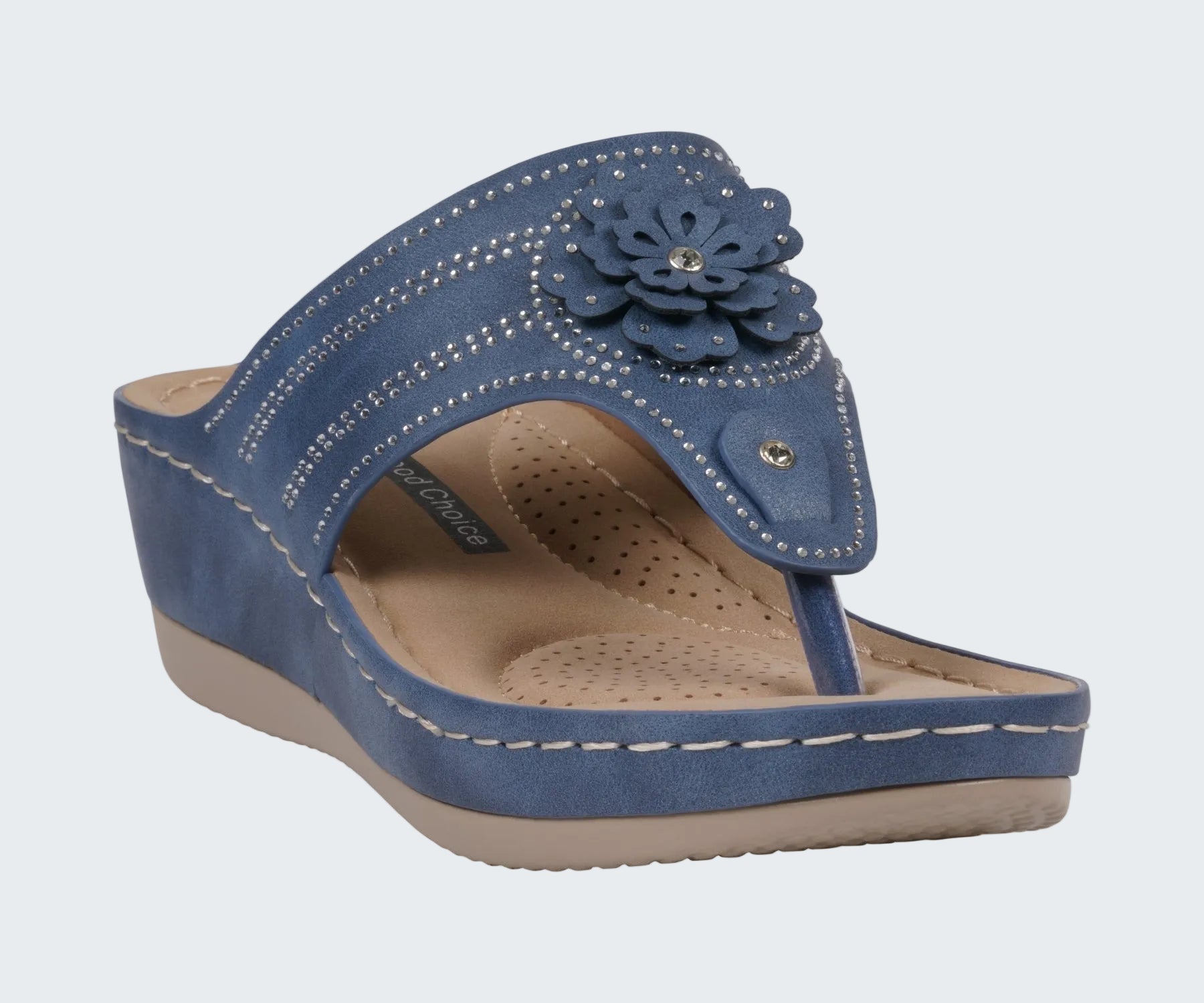 Blue sandal with a floral design on a white background