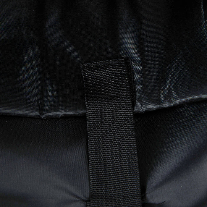 Close-up of a black strap on a black fabric background
