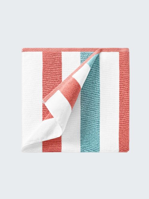 Folded fabric with red, white, and blue stripes on a white background