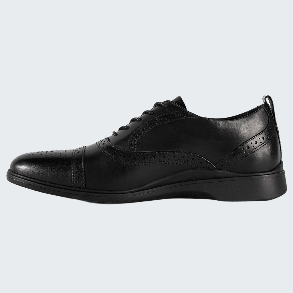 Black leather dress shoe on a white background