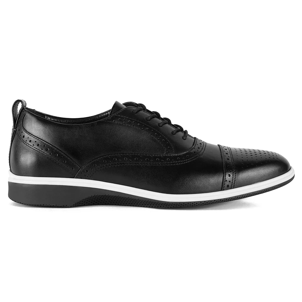 Black leather dress shoe with white sole on a white background