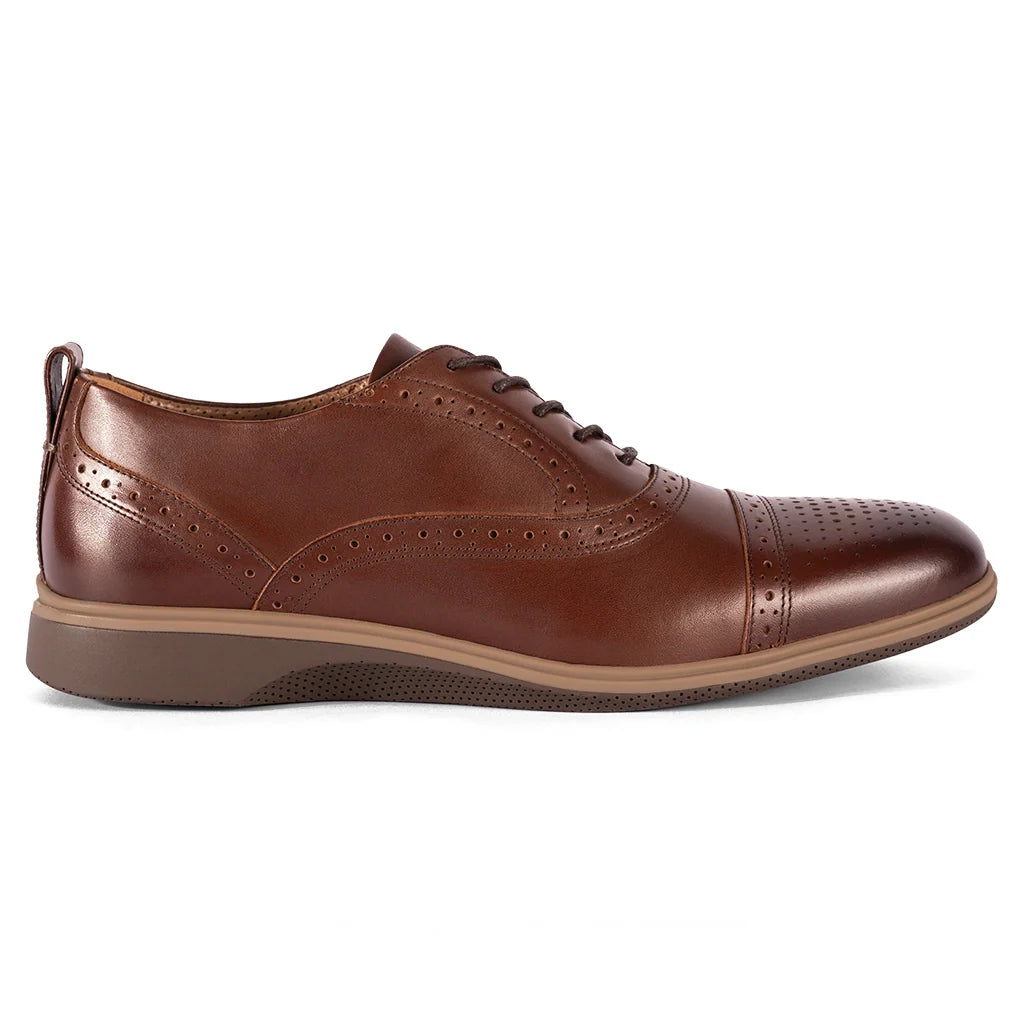Brown leather dress shoe on a white background