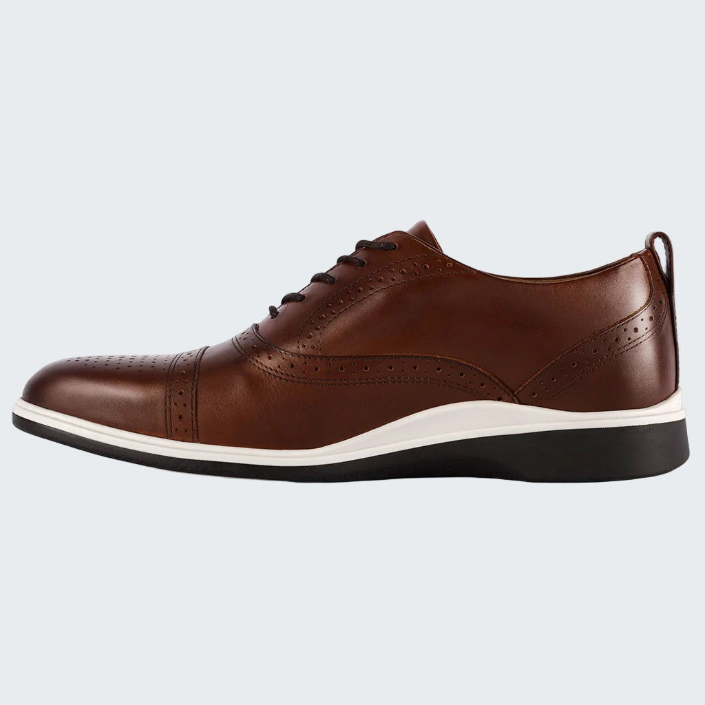 Brown leather shoe with a white sole on a white background