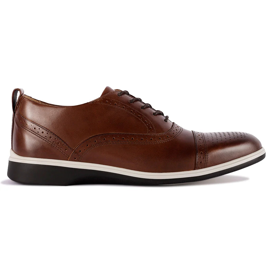 Brown leather dress shoe on a white background