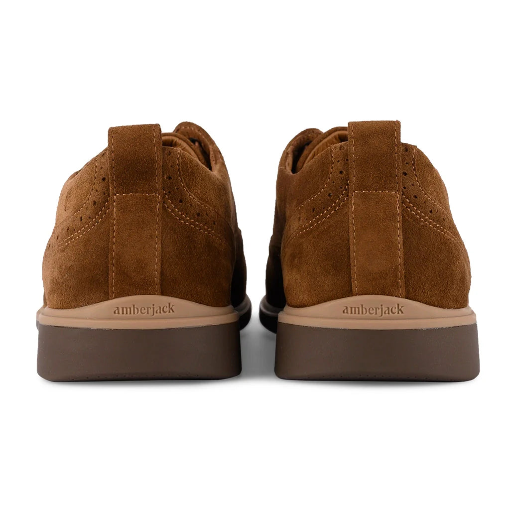 Brown suede shoes with 'amberjack' branding on a white background