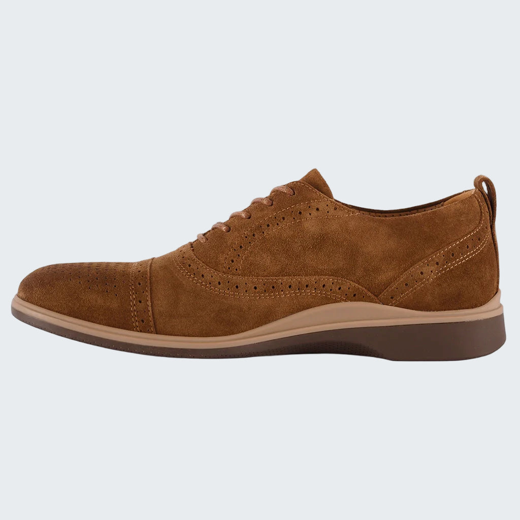 Brown suede shoe on a white background