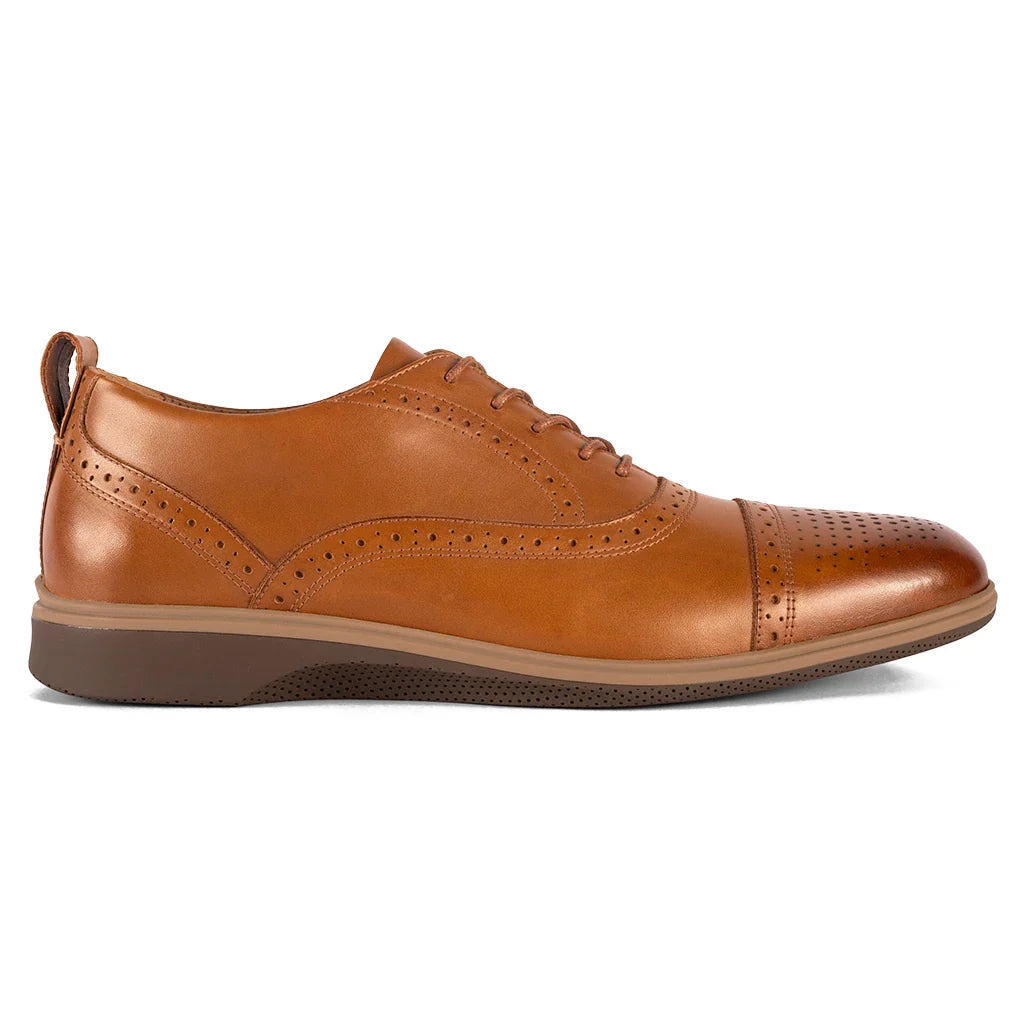 Brown leather dress shoe on a white background