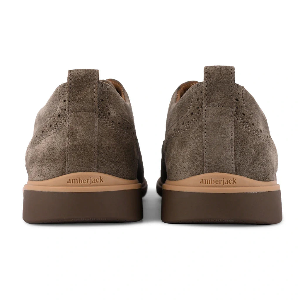Brown suede shoes with 'Amberjack' branding on a white background