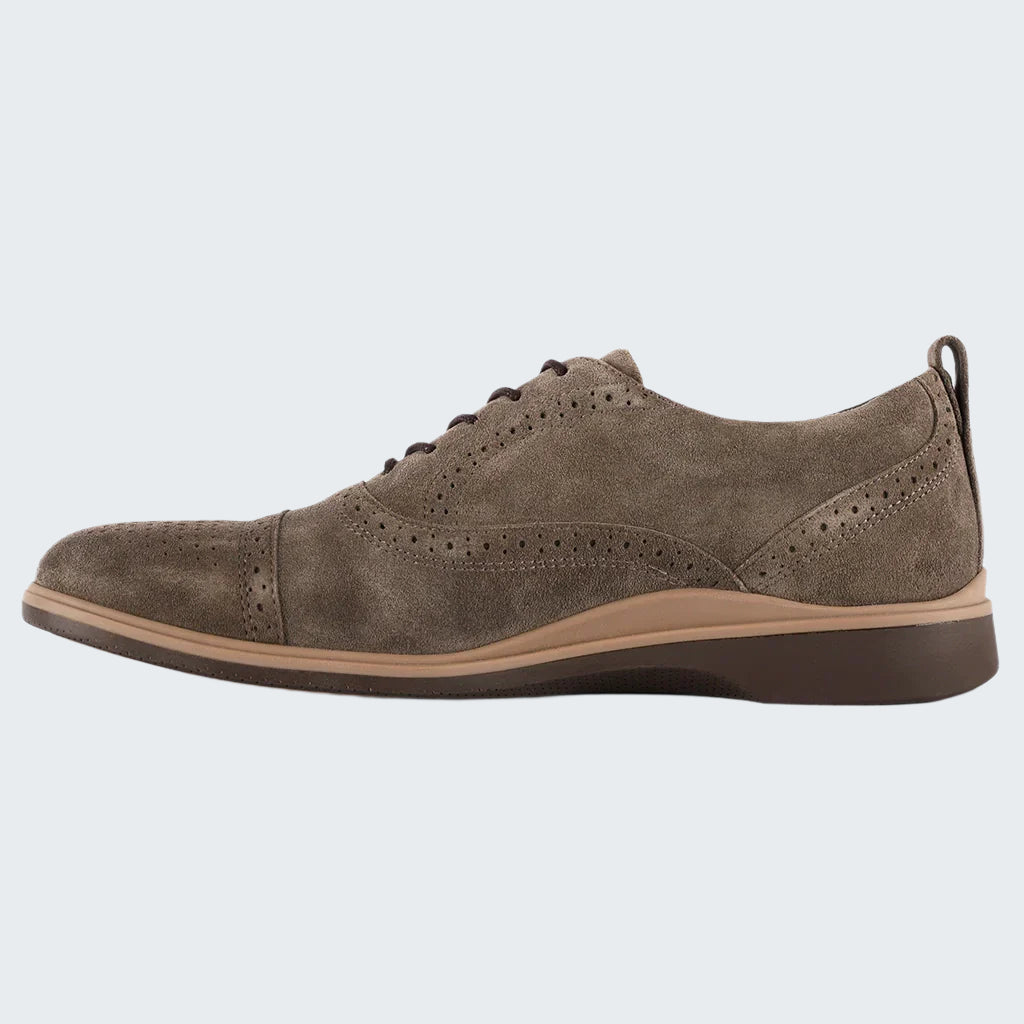 Brown suede shoe on a white background