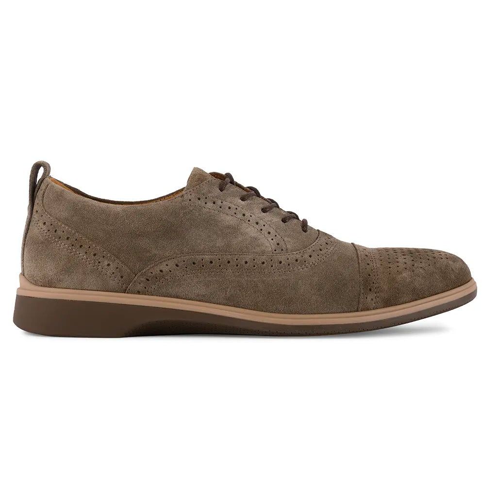 Brown suede dress shoe on a white background