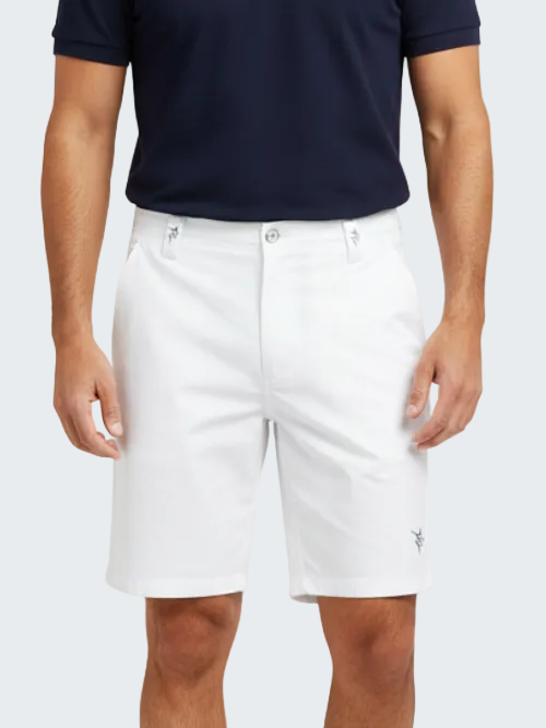 Person wearing white shorts and a navy polo shirt on a white background