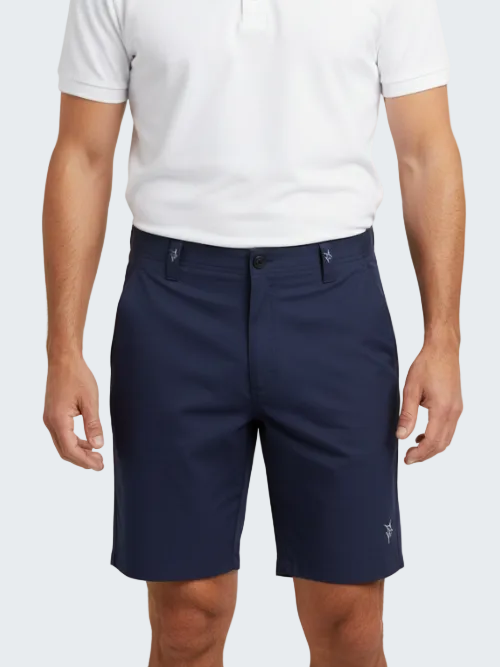 Person wearing navy shorts and a white polo shirt on a white background