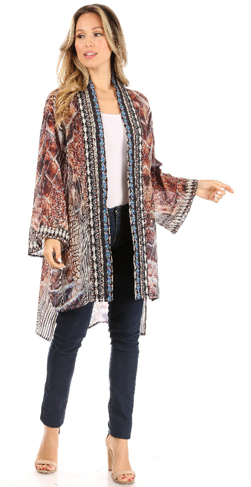 Woman wearing a patterned kimono-style jacket on a white background