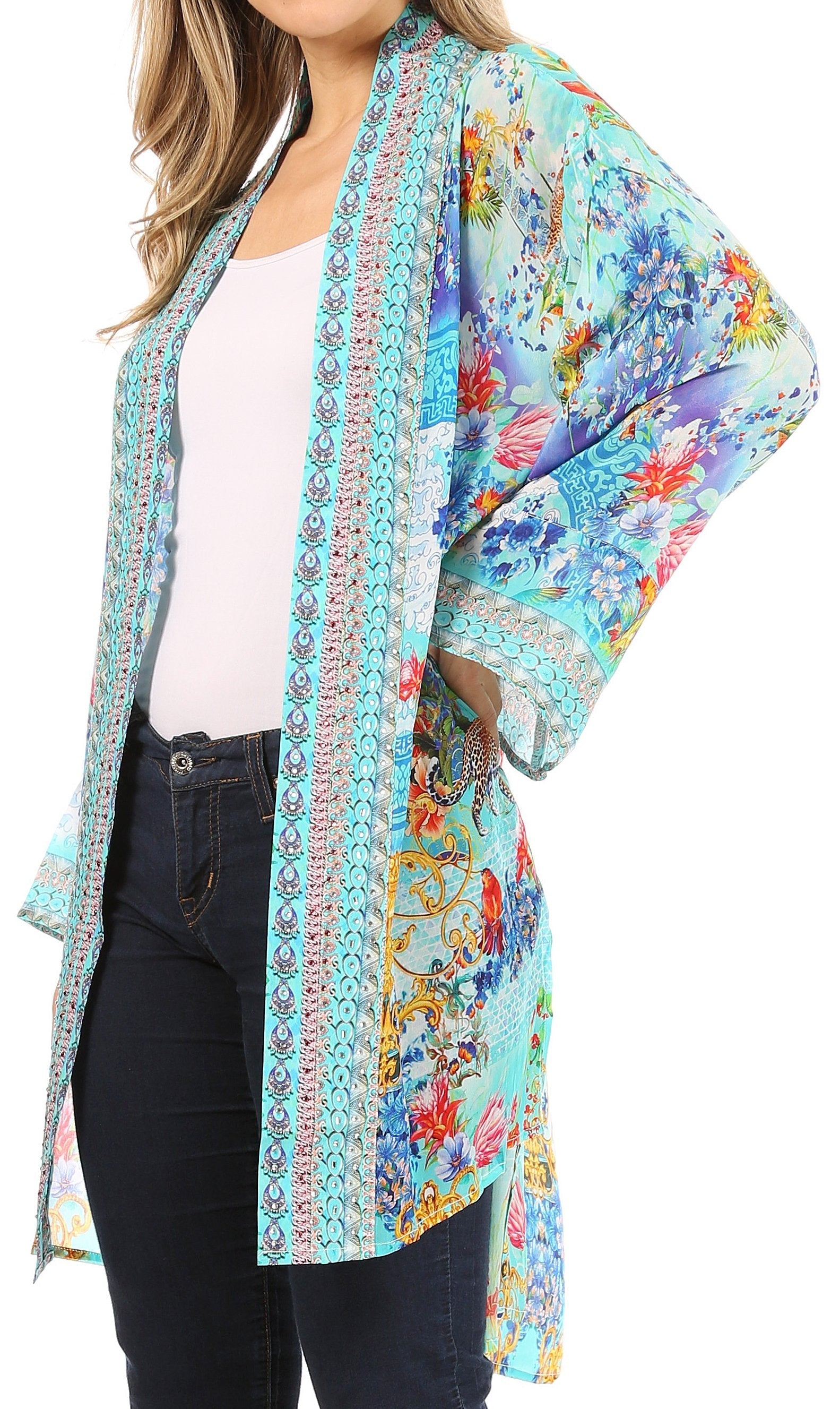 Colorful floral kimono-style jacket over a white shirt and black pants on a white background