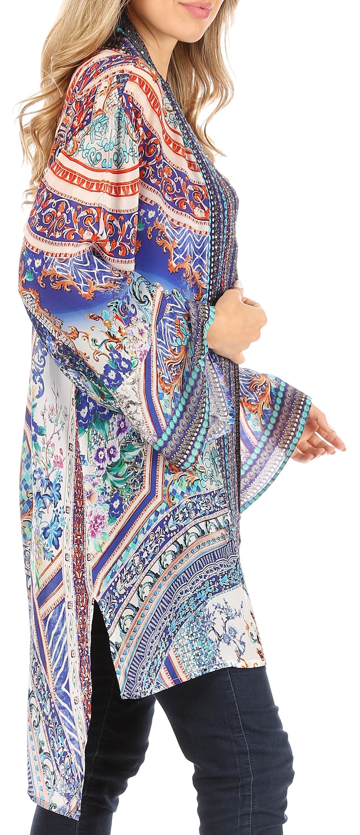 Woman wearing a colorful patterned kimono-style jacket on a white background
