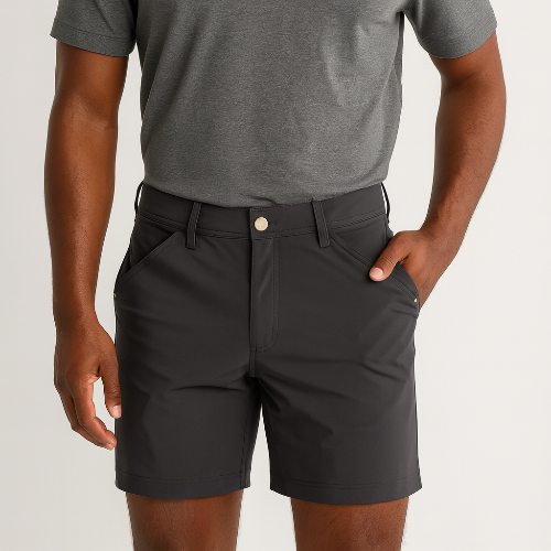 Person wearing black shorts and a gray shirt on a light gray background
