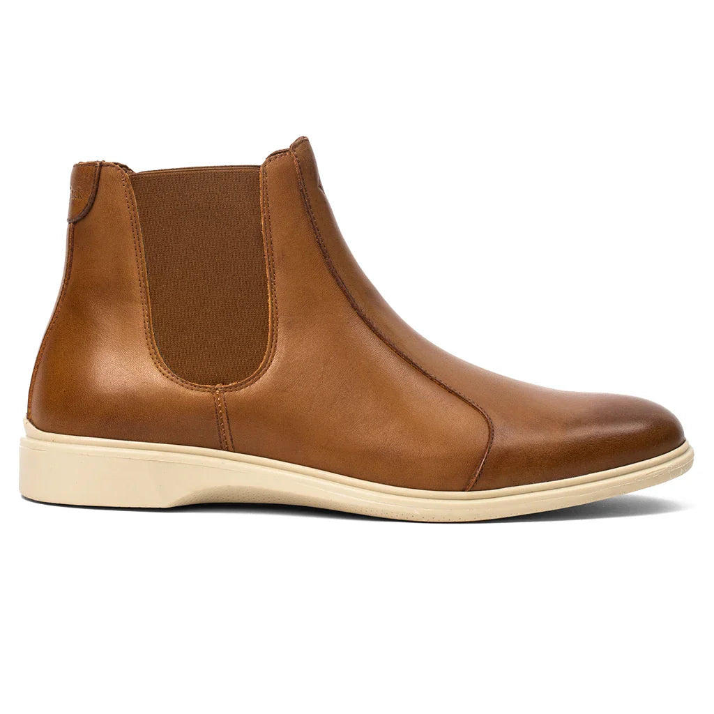 Brown leather Chelsea boot on a white background