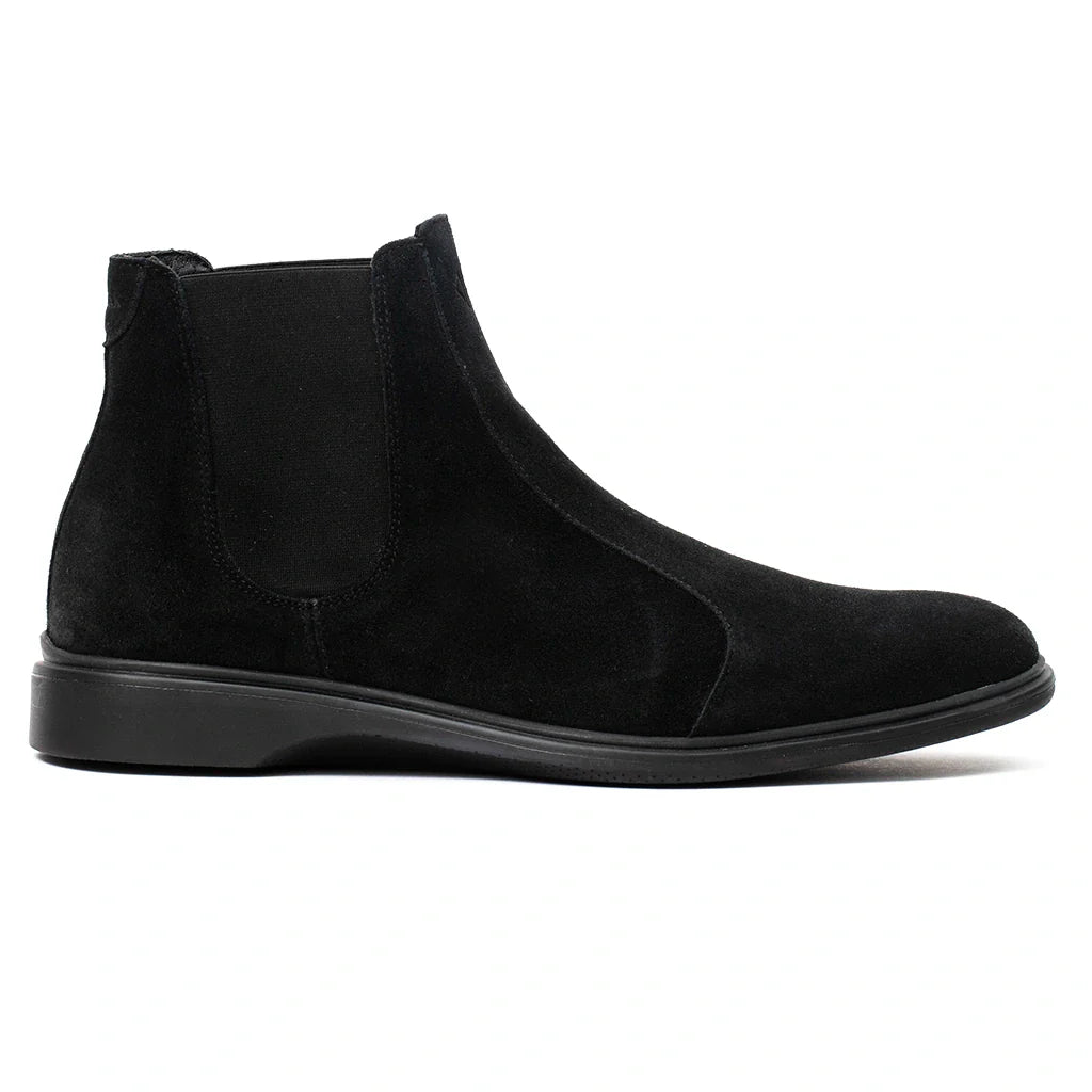 Black suede Chelsea boot on a white background