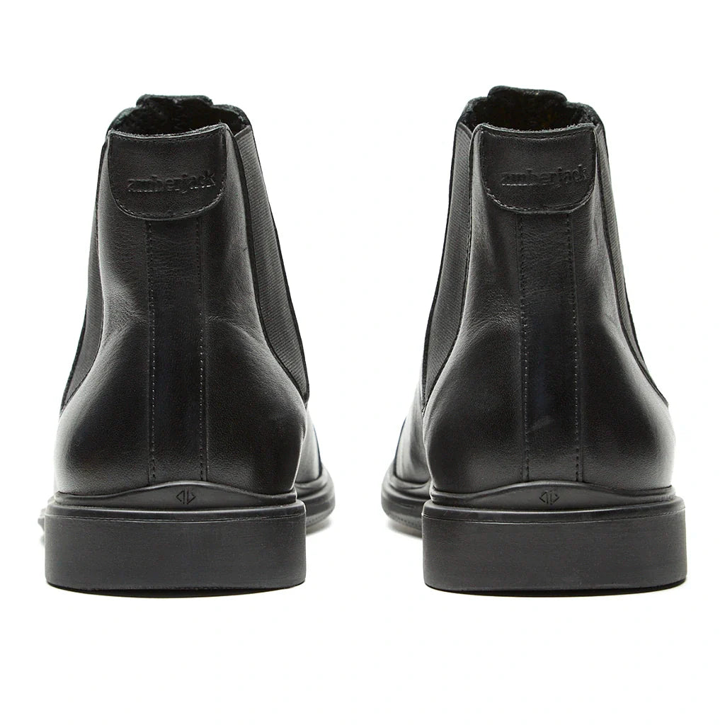 Black leather boots with brand logo on a white background