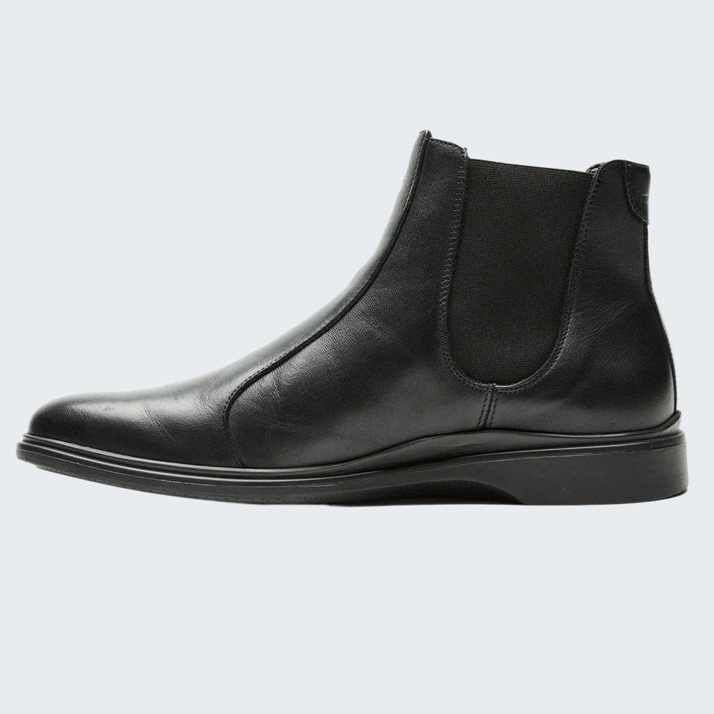Black leather Chelsea boot on a white background