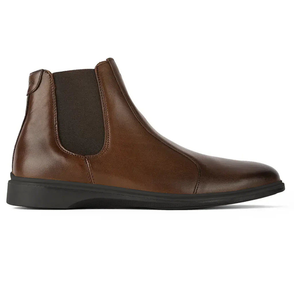 Brown leather Chelsea boot on a white background