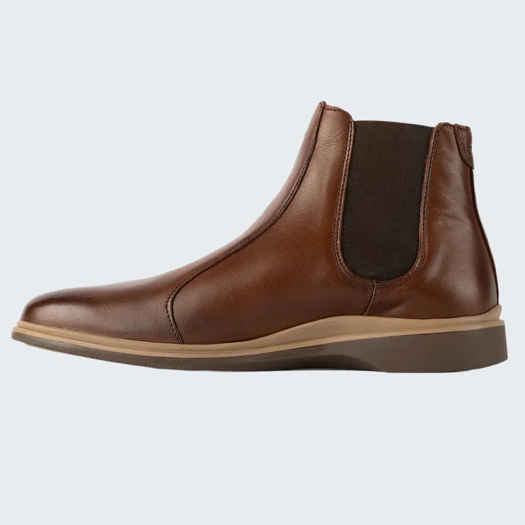 Brown leather Chelsea boot on a white background