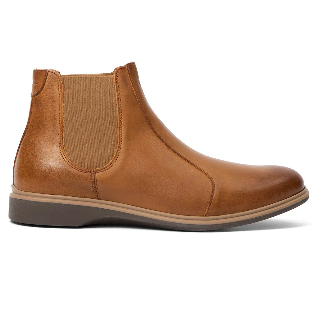 Brown leather Chelsea boot on a white background