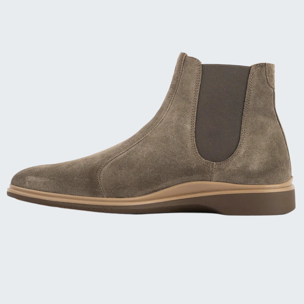 Brown suede Chelsea boot on a white background