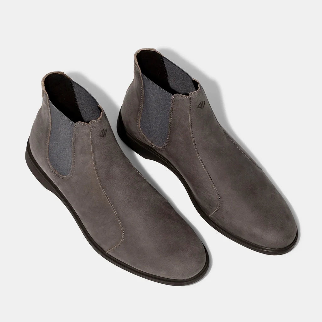 Pair of gray suede shoes on a light gray background