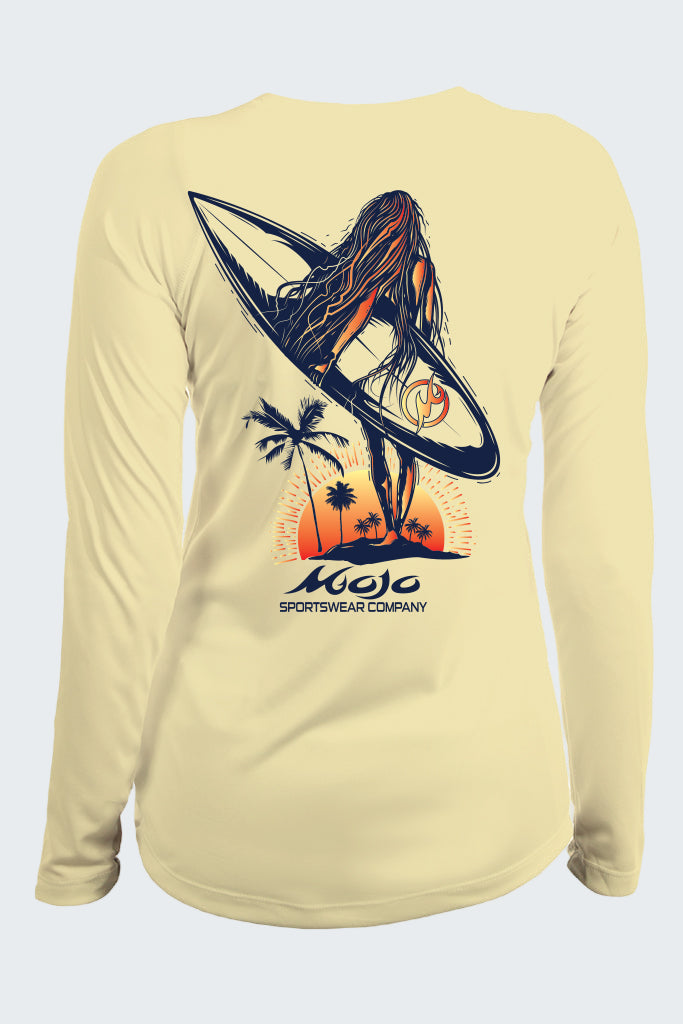 Beige long-sleeve shirt with a graphic of a woman on a surfboard and palm trees, featuring the Mojo Sportswear Company logo.
