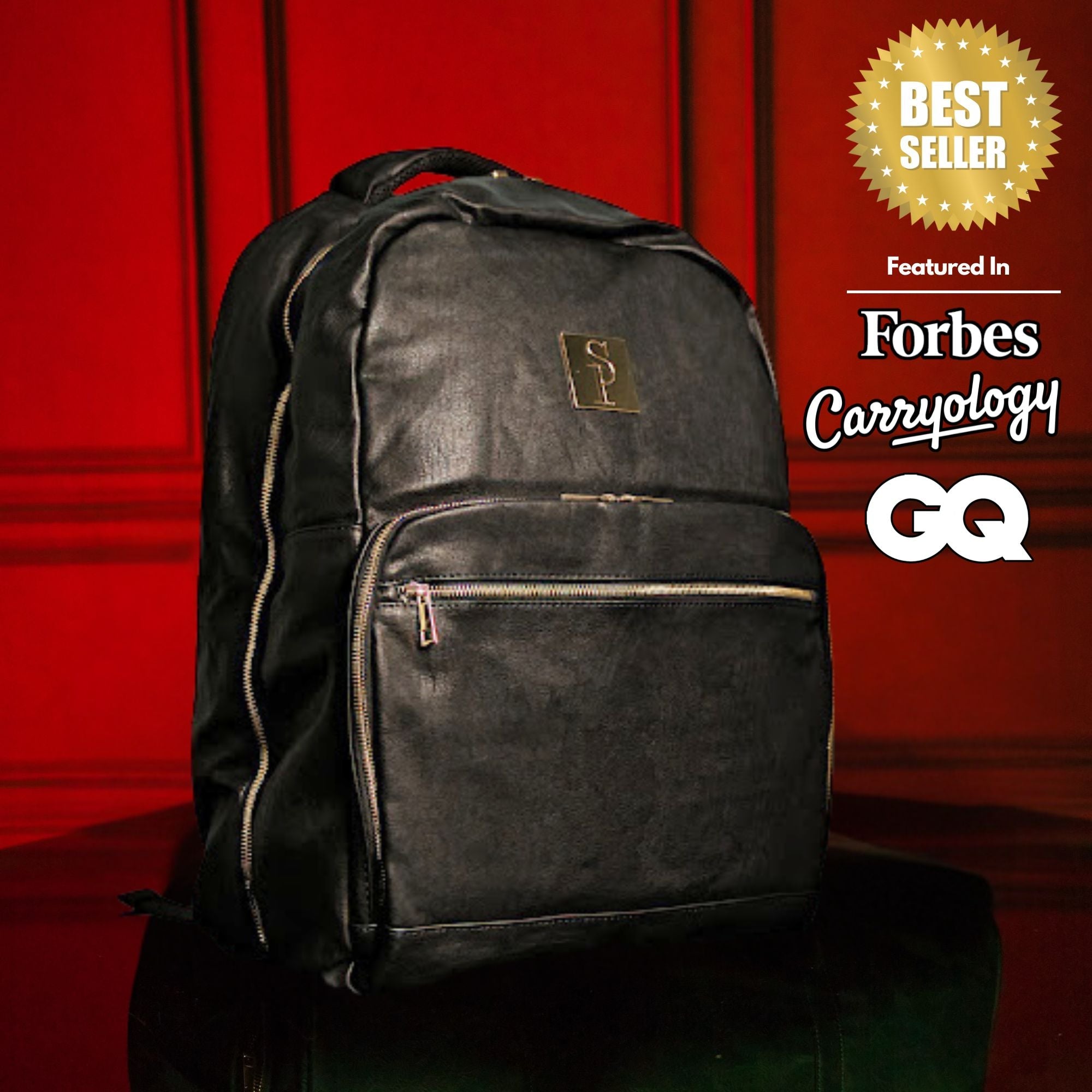 Black backpack with a brand logo on a red background, featuring 'Forbes Carryology' and 'GQ'.
